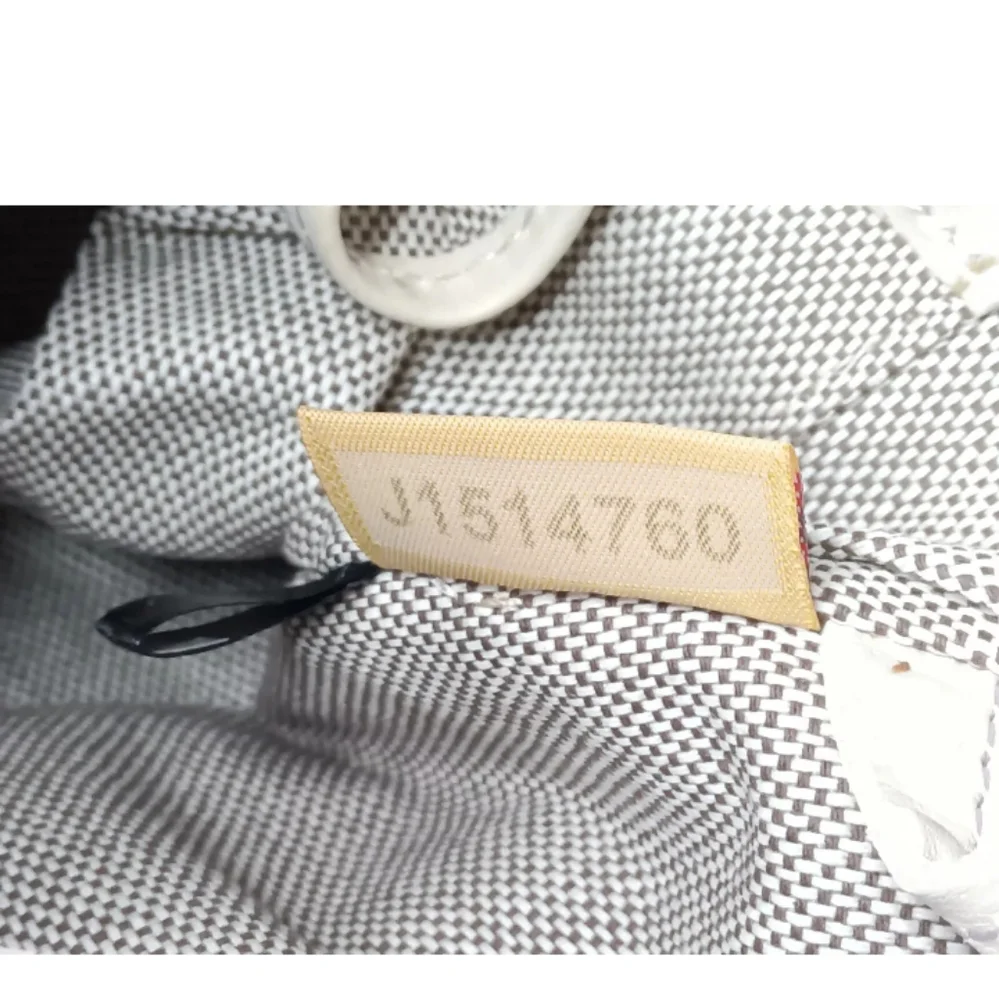 Dooney & Bourke Butter Yellow Ostrich-Embossed Satchel with lilac dots